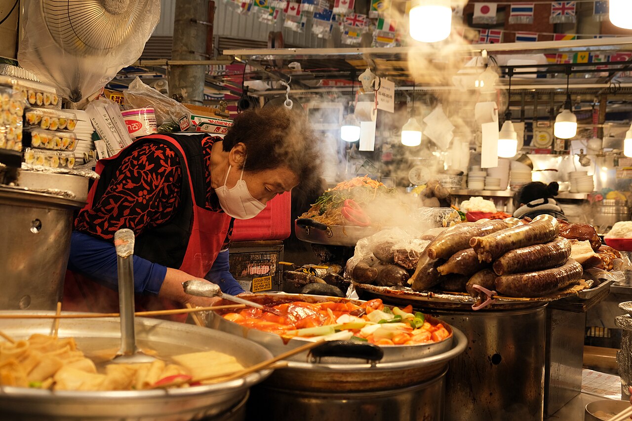 Vendor cooking street food at Gwangjang Market